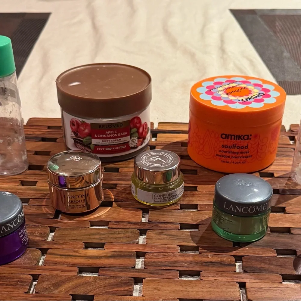 9 empty cosmetic containers: 2 glass ones & 7 plastic ones, variety of sizes